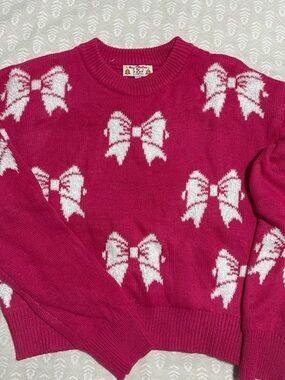 Poof! Pink Sweater with White Bow Pattern